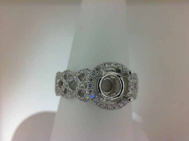 14K WHITE GOLD FOUR PRONG SEMI MOUNTING WITH .12CTTW ROUND SI CLARITY & G COLOR DIAMONDS SET ON THE SHANK
