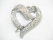 14K WHITE GOLD CIRCLE PENDANT WITH .24CTTW ROUND AND BAGUETTE I1 CLARITY & HI COLOR DIAMONDS O A CABLE CHAIN