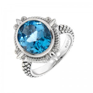 Sterling Silver Fleur De Lis Oval Bezel Blue Topaz Ring