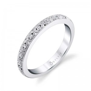 PLATINUM BAND WITH .08CTTW ROUND SI2 CLARITY & HI COLOR DIAMONDS SET IN A CRISSCROSS PATTERN FINGER SIZE 5.25