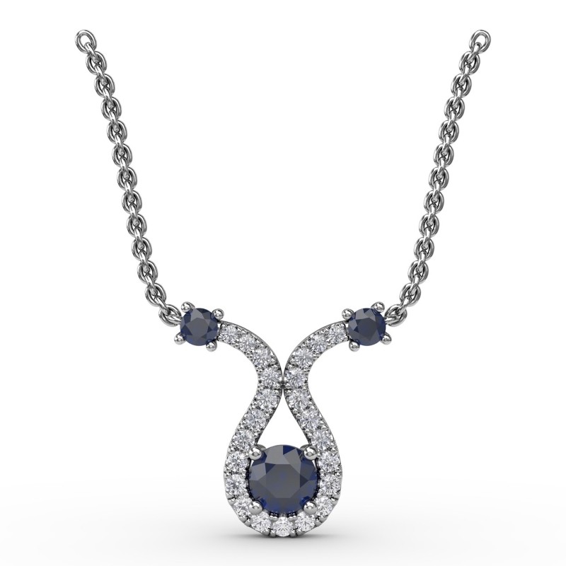 14K WHITE GOLD PENDANT WITH .17CTTW ROUND SI CLARITY & GH COLOR DIAMONDS SWIRLED AROUND THE .30CT ROUND SAPPHIRE ON AN 18