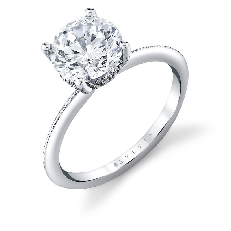 14K WHITE GOLD KNIFE EDGE SEMI MOUNT WITH A  .11CTTW SI/GH DIAMONDS IN THE HIDDEN HALO AND PRONGS FOR A 2CT ROUND