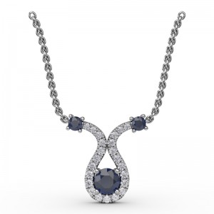 14K WHITE GOLD PENDANT WITH .17CTTW ROUND SI CLARITY & GH COLOR DIAMONDS SWIRLED AROUND THE .30CT ROUND SAPPHIRE ON AN 18