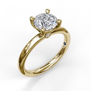 14K YELLOW GOLD SOLITAIRE SETTING WITH A FOUR PRONG 14K WHITE GOLD HEAD AND A RUBY PEEK A BOO UNDER THE HEAD