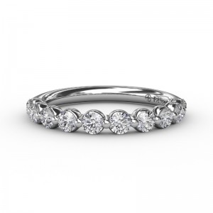 PLATINUM BAND WITH .58CTTW ROUND SI CLARITY & G COLOR DIAMONDS SET IN A SINGLE PRONG SETTING